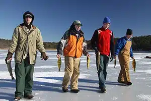 group of men ice fishing