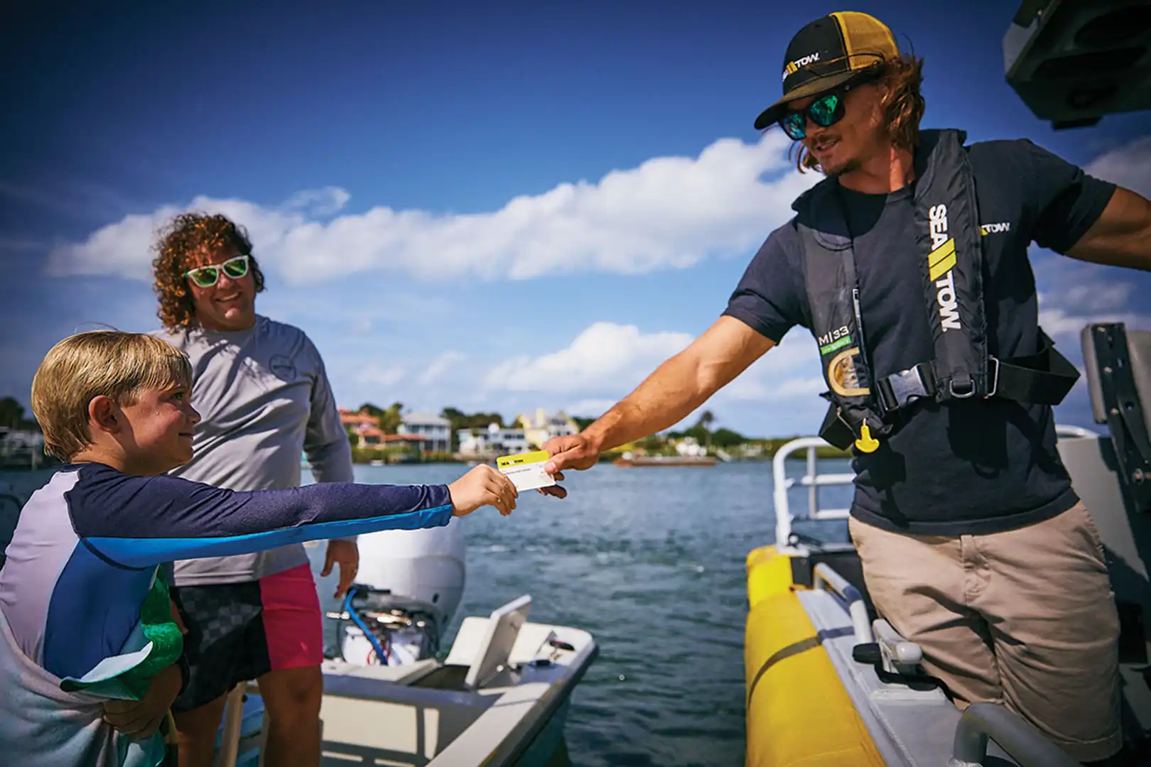 Sea Tow members handing membership card to captain